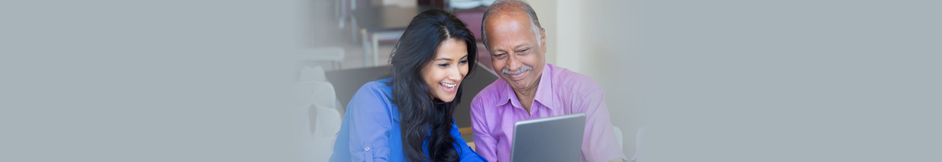 Closeup portrait, sitting young women showing elderly to use laptop